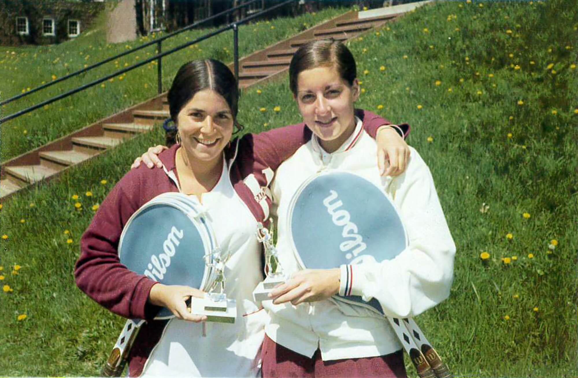 Denise Thal and another athlete holding tennis trophies