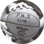 The 1973 Pinckney Pirates basketball team holding a Wilson basketball that reads "P.H.S. Girls"